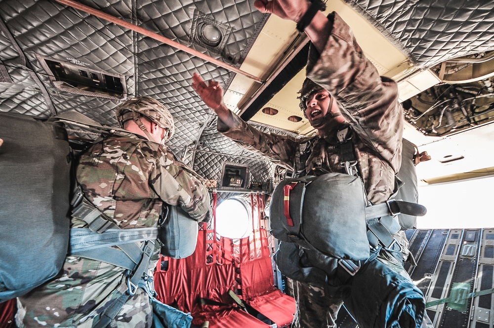 Paratroopers prepare to exit from CH-47 Chinook helicopter.