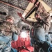 Paratroopers prepare to exit from CH-47 Chinook helicopter.