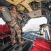 Paratroopers prepare to exit from CH-47 Chinook helicopter.