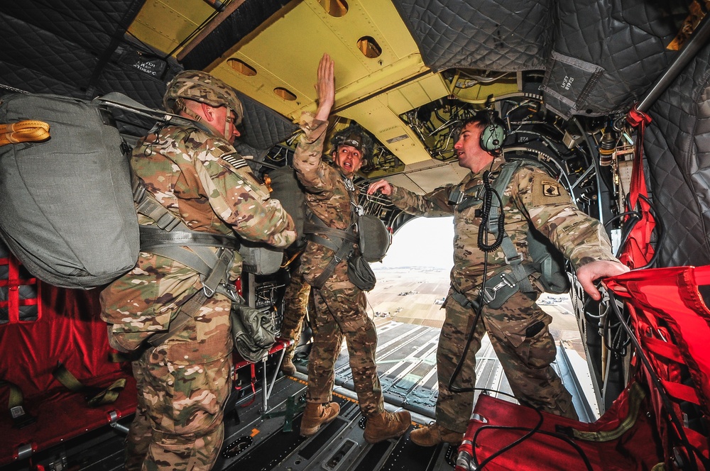 Paratroopers prepare to exit from CH-47 Chinook helicopter.