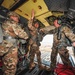 Paratroopers prepare to exit from CH-47 Chinook helicopter.