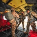 Paratroopers exit from CH-47 Chinook helicopter.