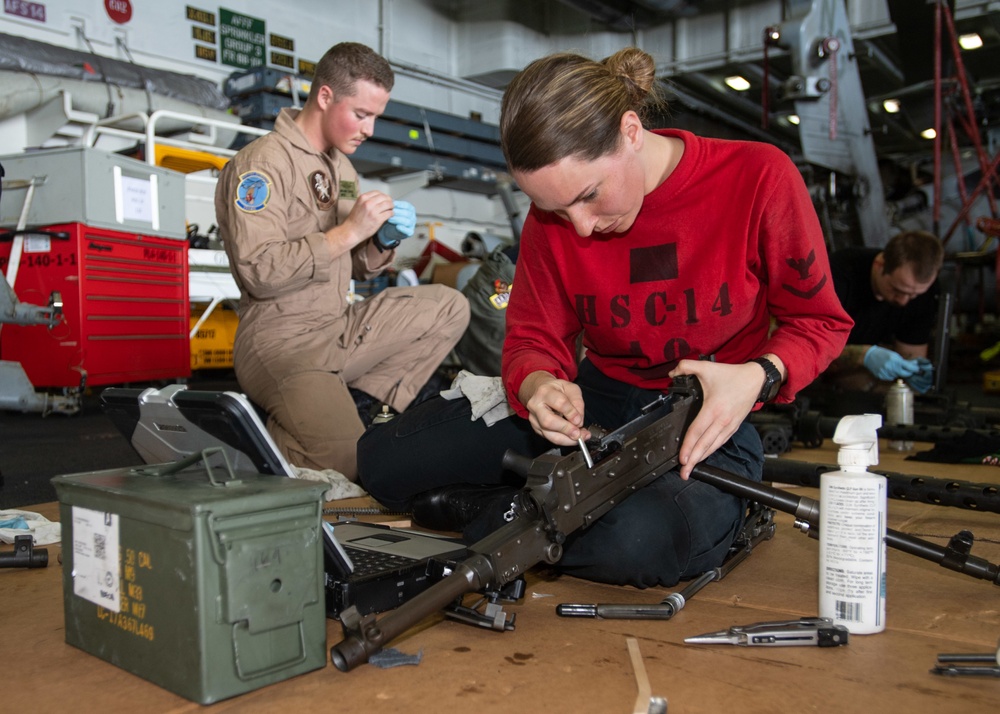 U.S. Sailor maintainns a machine gun