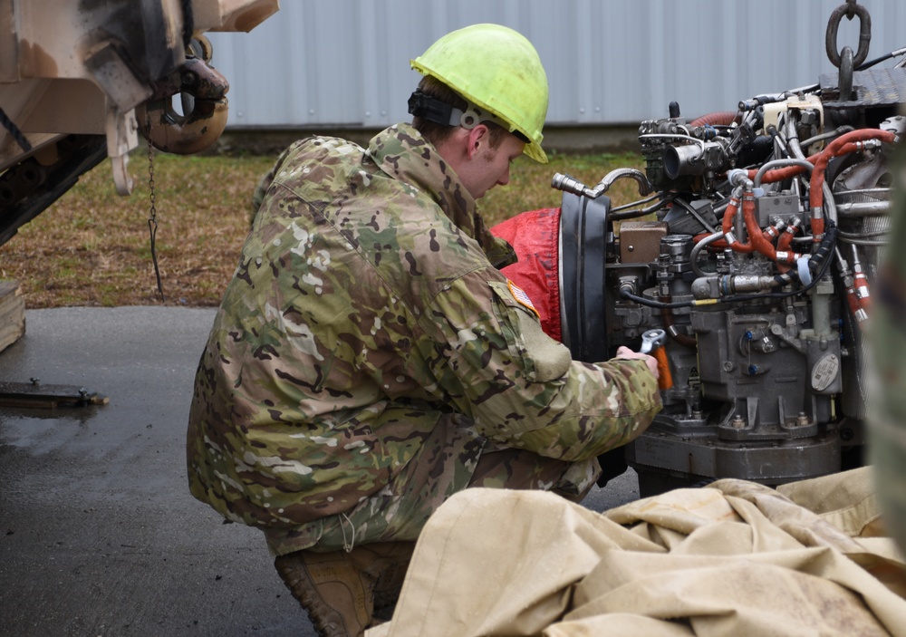 Soldiers, contractors perform maintenance on 4-118th CAB equipment in preparation for deployment