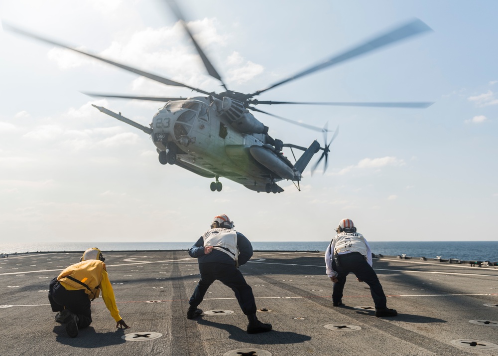 A CH-53E Super Stallion take off from the flight deck of  USS Ashland (LSD 48)
