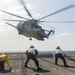 A CH-53E Super Stallion take off from the flight deck of  USS Ashland (LSD 48)