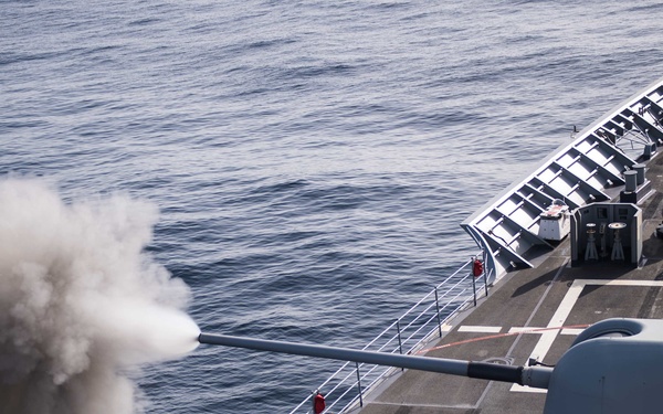 USS Mobile Bay (CG 53) fires a Mark 45 5-inch gun