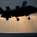 VMFA-121 naval aviators conduct flight operations at sunset aboard Wasp