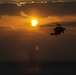 VMFA-121 naval aviators conduct flight operations at sunset aboard Wasp