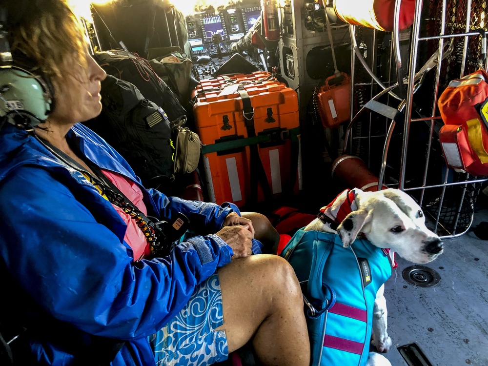 Coast Guard rescues woman, dog  1 mile west of North Cat Cay, Bahamas