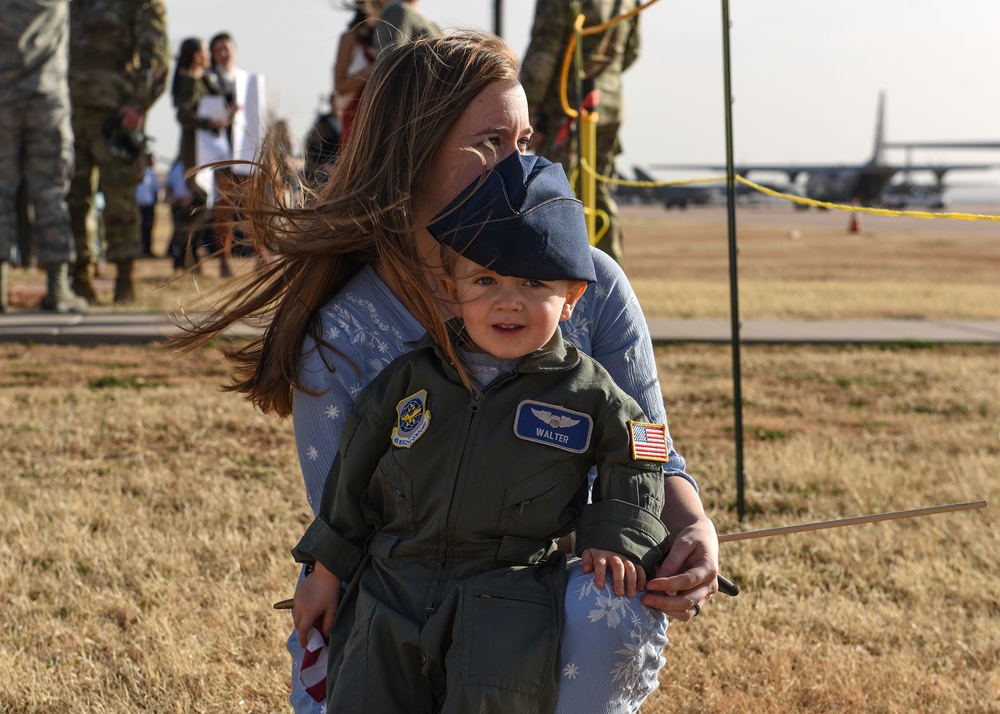 317th AW Airmen return home, embrace their families