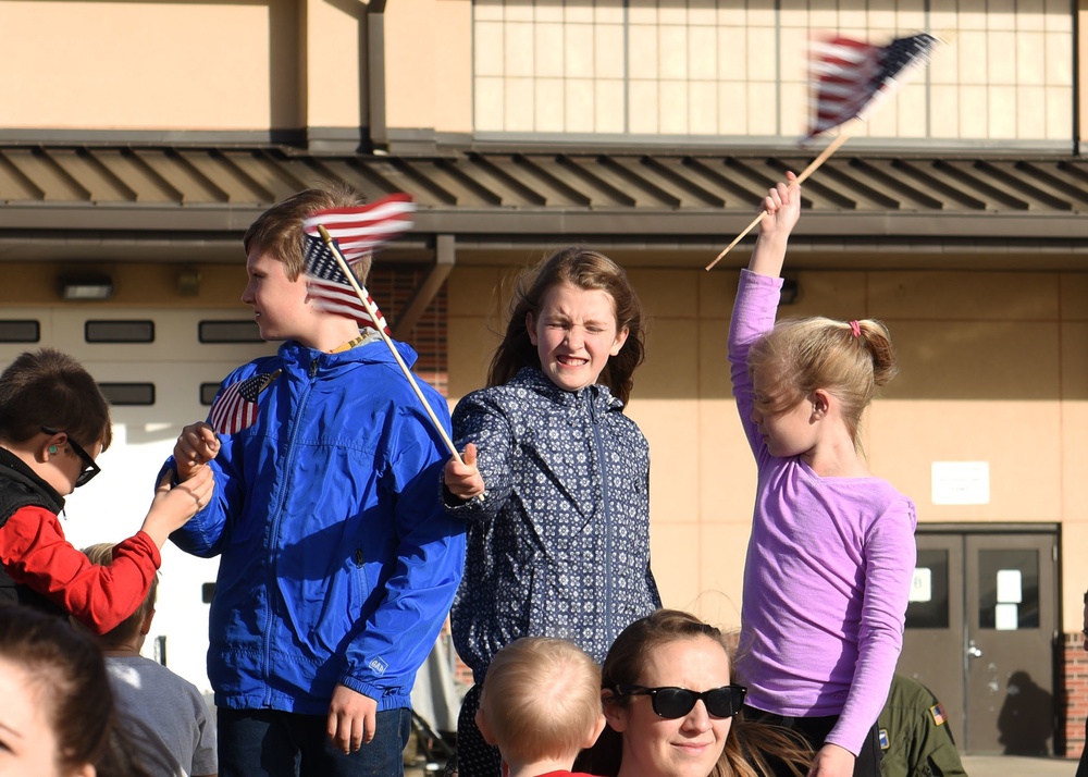 317th AW Airmen return home, embrace their families