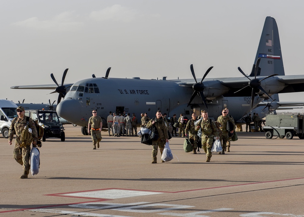 317th AW Airmen return home, embrace their families