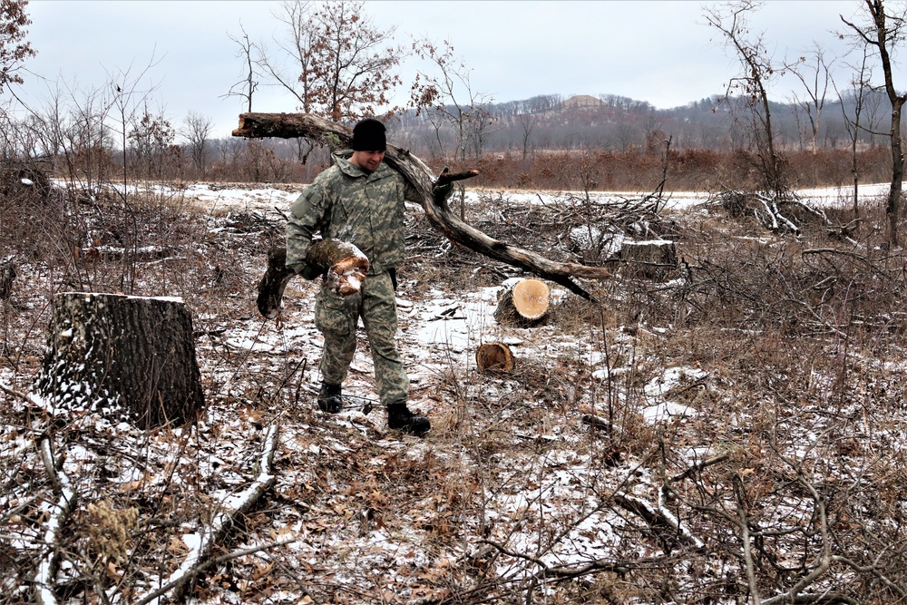 Cold-Weather Operations Course students build improvised shelters, survive outdoors