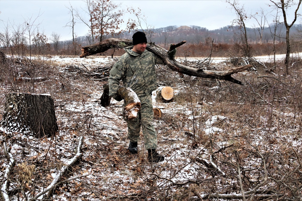 Cold-Weather Operations Course students build improvised shelters, survive outdoors