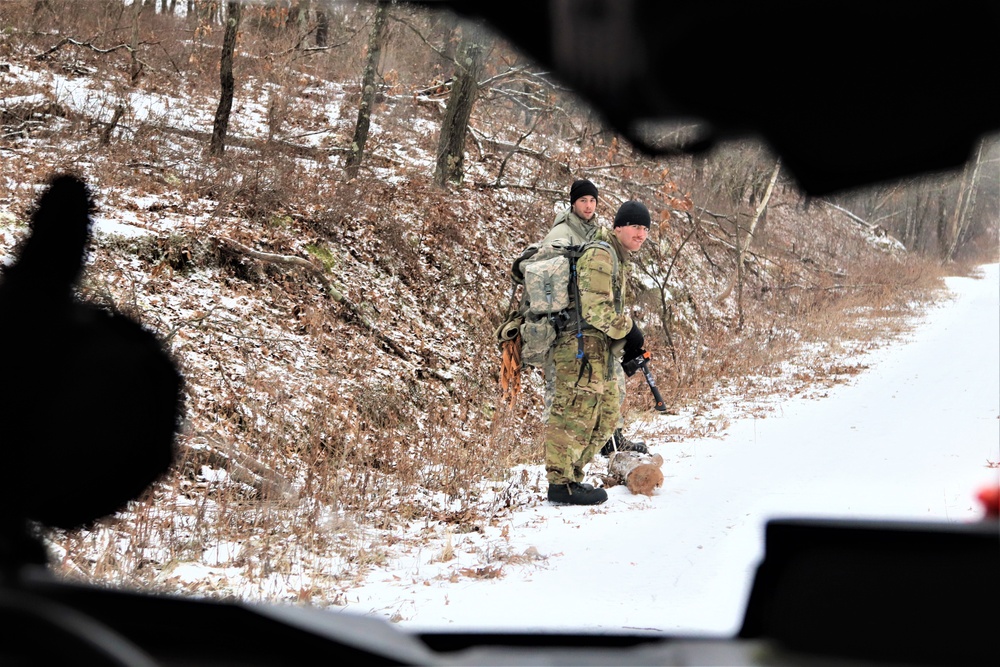 Cold-Weather Operations Course students build improvised shelters, survive outdoors