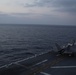 VMFA-121 naval aviators conduct flight operations at sunset aboard Wasp