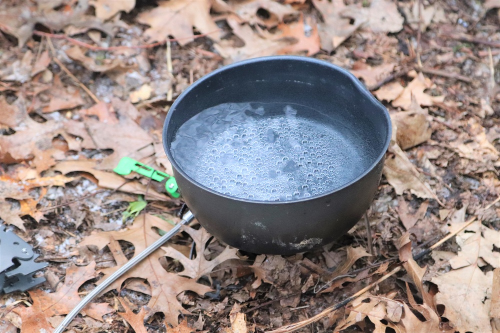 Cold-Weather Operations Course students build improvised shelters, survive outdoors