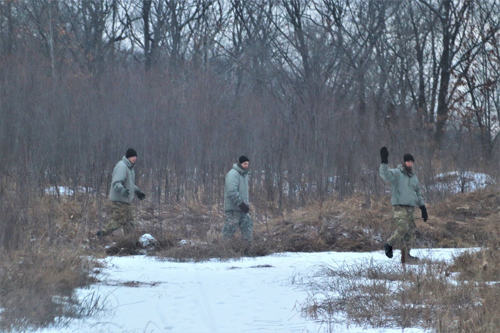 Cold-Weather Operations Course students build improvised shelters, survive outdoors