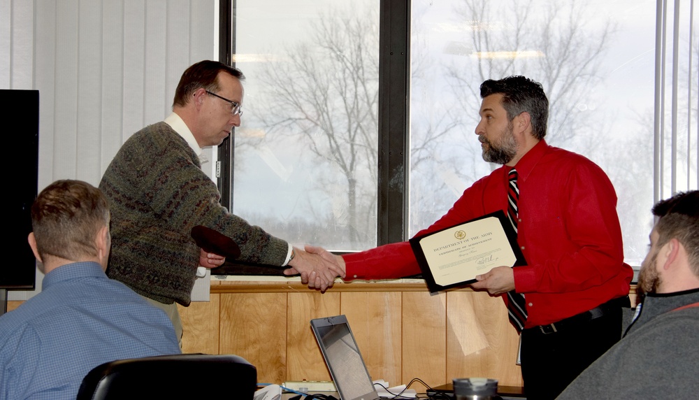 Greg Kiaer, Civil Engineer, receives Certificate of Achievement for presentation