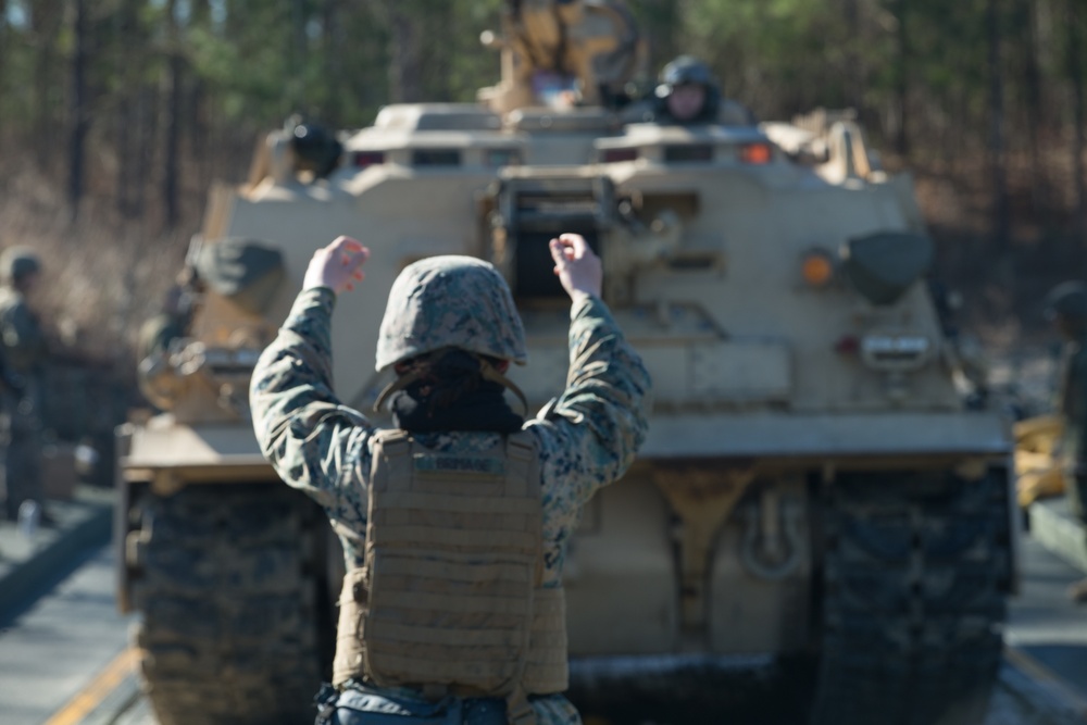 Marines use bridging techniques to move tanks across 2 miles of open water