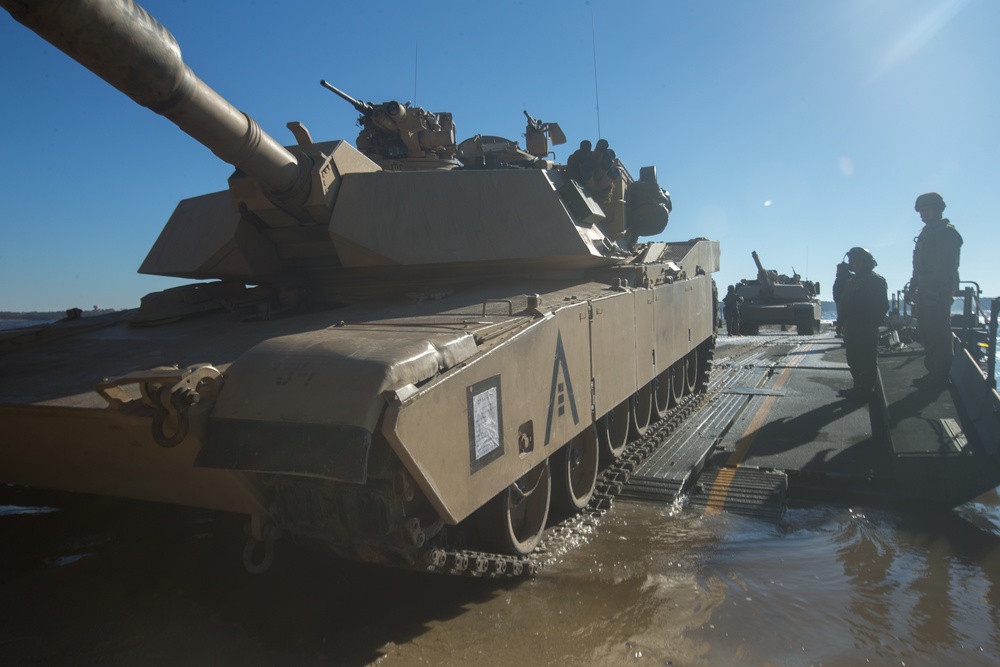 Marines use bridging techniques to move tanks across 2 miles of open water