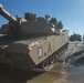 Marines use bridging techniques to move tanks across 2 miles of open water