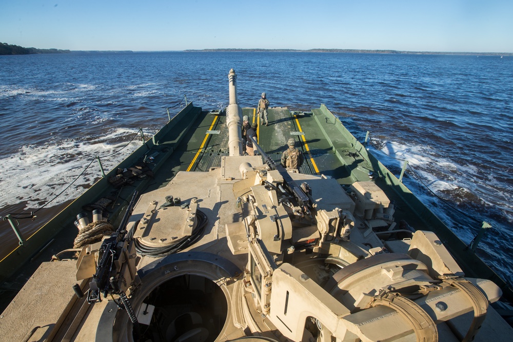 Marines use bridging techniques to move tanks across 2 miles of open water