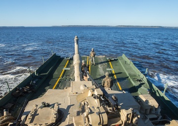 Marines use bridging techniques to move tanks across 2 miles of open water