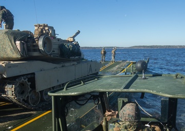 Marines use bridging techniques to move tanks across 2 miles of open water