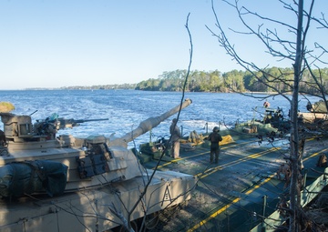 Marines use bridging techniques to move tanks across 2 miles of open water