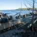 Marines use bridging techniques to move tanks across 2 miles of open water