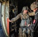 Jumpmaster Candidate hands static line to Instructor