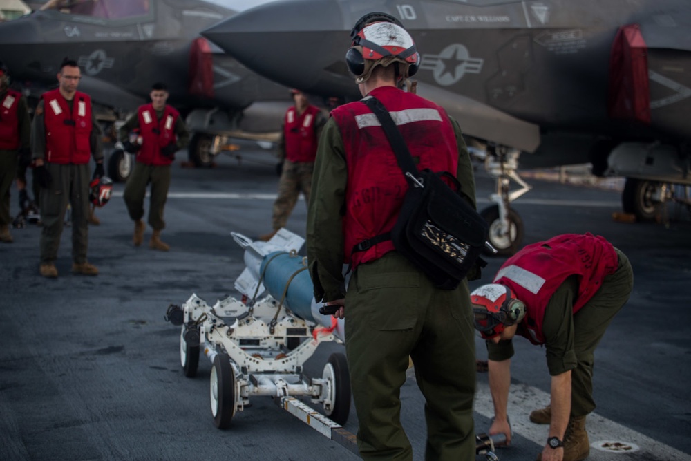 VMM-262 (REIN) Marines load inert ordnance onto F-35Bs aboard Wasp