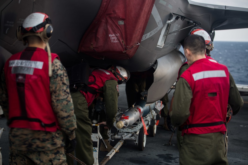 VMM-262 (REIN) Marines load inert ordnance onto F-35Bs aboard Wasp