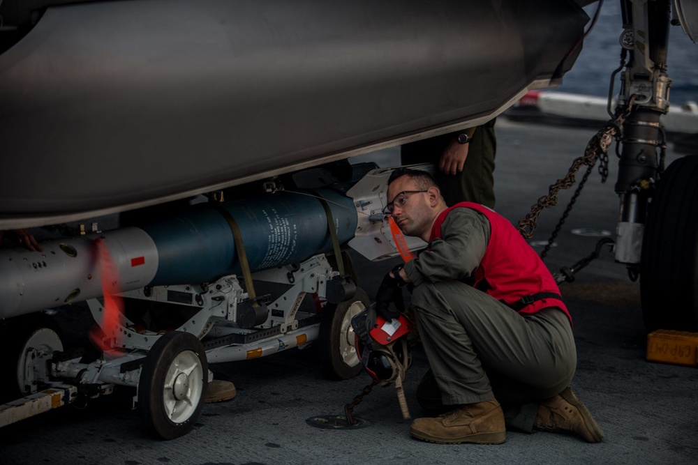 VMM-262 (REIN) Marines load inert ordnance onto F-35Bs aboard Wasp