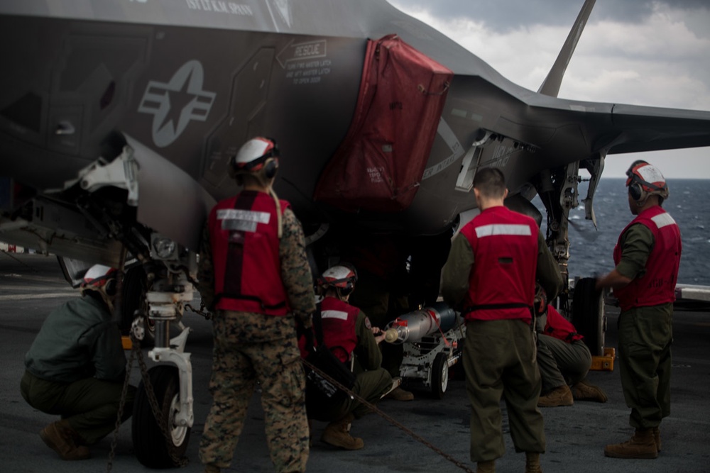 VMM-262 (REIN) Marines load inert ordnance onto F-35Bs aboard Wasp