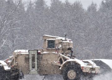 Vehicle training ops in January snow at Fort McCoy