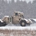 Vehicle training ops in January snow at Fort McCoy