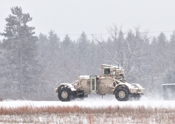 Vehicle training ops in January snow at Fort McCoy