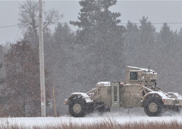 Vehicle training ops in January snow at Fort McCoy