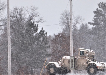 Vehicle training ops in January snow at Fort McCoy