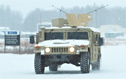 Vehicle training ops in January snow at Fort McCoy