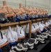 Childrens ice hockey gear lines the holding racks