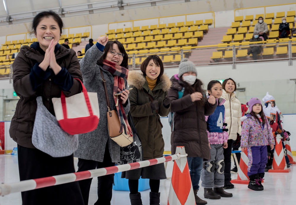 Family cheers the players during the Misawa Children's Ice Hockey Competition