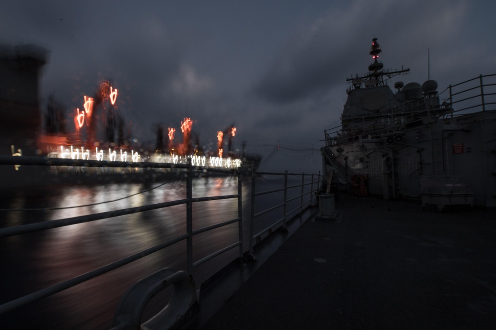 USS Mobile Bay conducts a replenishment-at-sea