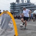 U.S. Sailor plays soccer during a steel beach picnic