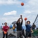 U.S. Sailors play basketball during a steel beach picnic