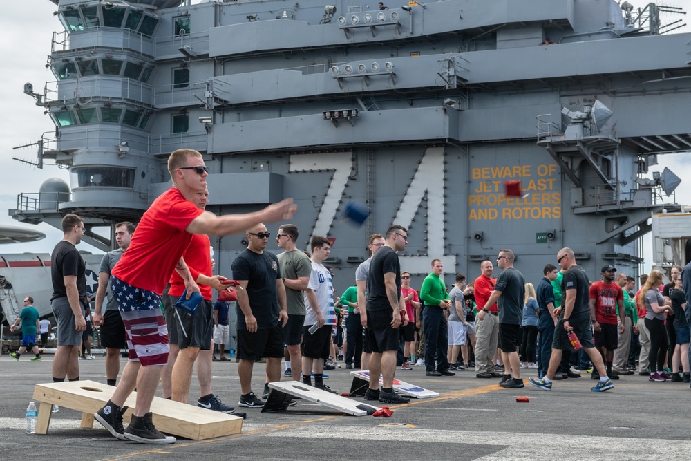 U.S. Sailor participates in a game during steel beach picnic