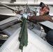 U.S. Sailor cleans a tail gear box
